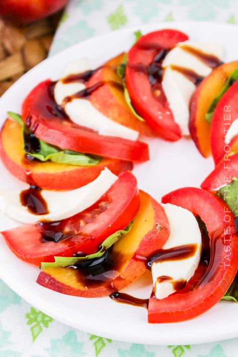 Peach Caprese Salad features juicy peaches, fresh mozzarella, basil, and a drizzle of balsamic glaze to create a perfect summer salad. Peach Caprese Salad, Peach Caprese, Breakfast Donuts, Diy Dish, Quick Side Dishes, Side Dish Recipes Easy, Edible Cookies, Edible Cookie Dough, Eat Lunch