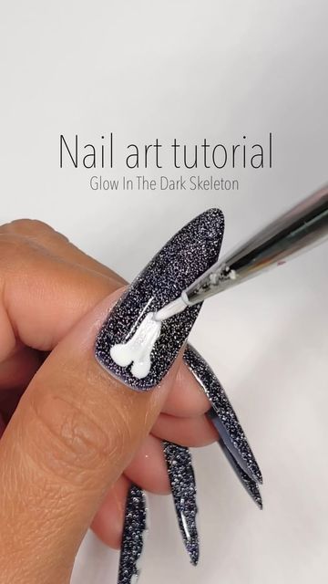 Jen Flores ♡ on Instagram: "Tutorial Time!!🎥💅🏽 Glow in the dark skeleton nails! 🦴✨🖤 SAVE & SHARE this reel under Halloween nail inspo! Using: @daily_charme (code: JEN10) •H63 Abracadabra •002 Perfect White •Glow In The Dark White Pigment #dailycharme #dailycharmeambassador #tutorial #bonenails #skeletonnails #holographicnails #reflectivenails #glowinthedarknails #halloween #nailsofinstagram #nailart #nailinspo #coolnails #nailreels #nailvideos #satisfying #trending #nailtrends #stilettonai Bone Nail Art Tutorial, Glow In The Dark Skeleton Nails, Skeleton Bone Nails, Skeleton Hand Nails, Skeleton Nails Designs, Glow In The Dark Halloween Nails, Halloween Nails Skeleton, Bone Nail Art, Skeleton Nail Art