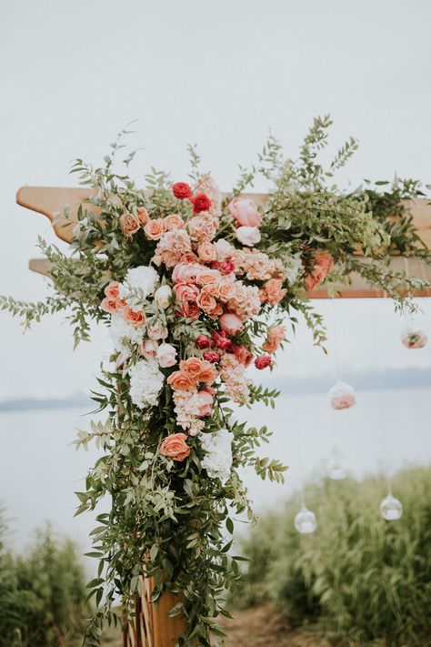 Peach And Pink Wedding Backdrop, Peach And White Wedding Florals, Orange Pink Coral Wedding Flowers, Peach Arbor Flowers, Coral Wedding Florals, Coral Colored Flowers, Soft Peach Wedding Theme, Peach Wildflower Wedding, Summer Wedding Arbor