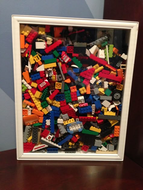 Shadow box filled with random Lego as wall art Diy Lego Wall Decor, Lego Wall Art Diy, Toy Shadow Box Display, Lego Shadow Box Ideas Diy, Lego Box Frame, Display Boxes For Lego, Lego Wall Art, Toy Collection Display, Lego Room Decor