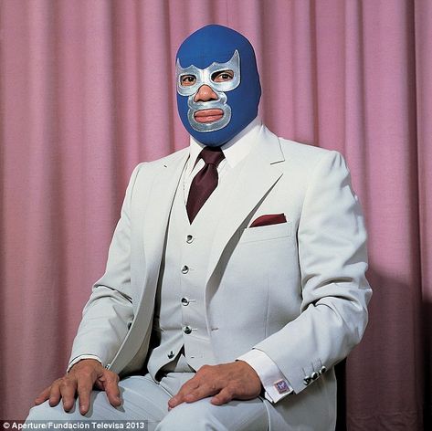 Proud fighter: The Mexican luchador and professional wrestler Blue Demon sits proudly in front of a colorful curtain (Lourdes Grobet, 1980) Mexican Wrestler, Foto Transfer, Blue Demon, Drop Cloth Curtains, Latin American Art, Professional Wrestler, Mexican Culture, Colorful Curtains, Colour Photograph