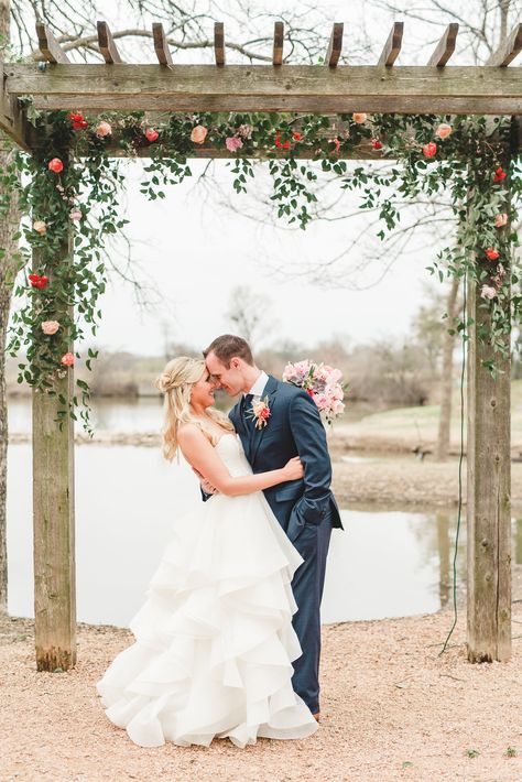 Smilax vine arbor with pops of peach & coral flowers for outdoor Texas wedding. Lindsay Davenport Photography. Wooden Wedding Arch With Flowers, Arbor Greenery, Vine Arbor, Smilax Vine, Trellis Wedding, Lindsay Davenport, Peach Blush Wedding, Wedding Trellis, Wooden Wedding Arches