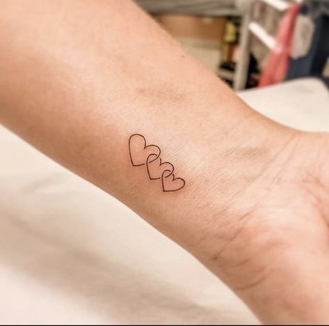 Three Linked Hearts Tattoo, 3 Heart Tattoos For Women, 3 Way Tattoo, Wrist Family Tattoos For Women, Three Heart Tattoo Designs, 3 Hearts Tattoo Ideas Mother Daughters, Micro Heart Tattoo Wrist, 3 Small Heart Tattoo On Wrist, Family Wrist Tattoos For Women