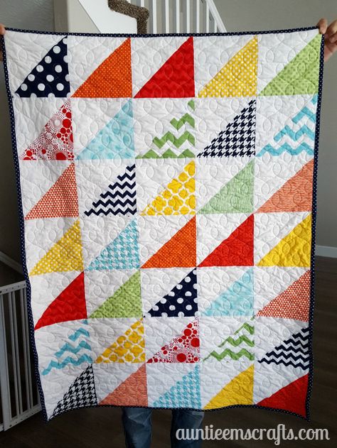 Rainbow Half Square Triangle Quilt. This rainbow HST (half square triangle) quilt came together in just one day.  You, too, can make one quickly with scraps or even a layer cake.| Auntie Em's Crafts Layer Cake Half Square Triangle Quilts, Scrap Quilts Using Half Square Triangles, Half Square Triangle Quilts Pattern Free, Half Square Triangle Baby Quilts Pattern, Half Square Triangle Scrappy Quilt, Quilt Patterns Rainbow, Rainbow Half Square Triangle Quilt, Half Square Triangle Quilts Pattern, Patchwork Quilting Designs