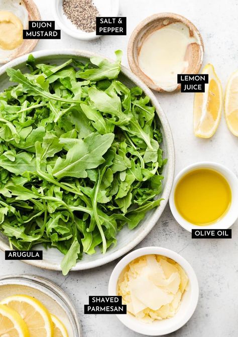 This easy arugula salad is ready in just five minutes! Shake some olive oil, lemon juice, and Dijon mustard together in a jar for a quick dressing, then toss it all up with plenty of fresh arugula and parmesan cheese. Mix it up by adding your favorite cheeses (we like blue cheese, feta, or goat cheese, protein like chicken or salmon, or extra fruits and veggies like avocado, beets, strawberries, or tomatoes. This is a perfect blank canvas salad for a quick, healthy side dish! Vegetarian. Simple Arugula Salad Recipes, Healthy Arugula Salad, Goat Cheese Arugula Salad, Salmon Arugula Salad, Arugula Side Salad, Italian Apps, Lemon Arugula Salad, Easy Arugula Salad, Arugula Goat Cheese Salad