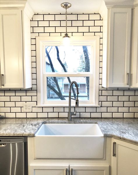 Farmhouse sink. Beveled white subway tile. Charcoal grout. Subway Tile Charcoal Grout, White Subway Tile Black Grout, White Subway Tiles Kitchen Backsplash, Charcoal Grout, Grey Window Frames, White Kitchen Rustic, White Kitchen Lighting, White Kitchen Paint, Kitchen Sink Window