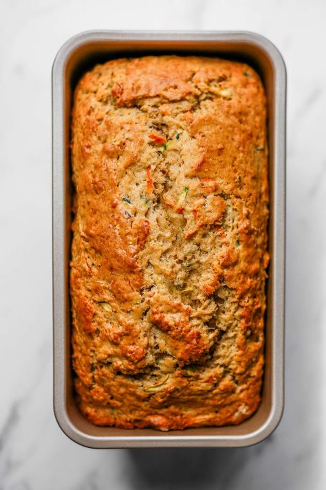 You'll love this light and fluffy Sourdough Discard Zucchini Carrot Bread with pistachios and an icing drizzle for perfect sweetness and texture. This bread is ideal for any spring or summer get-together. Pair it with coffee or tea for a lovely afternoon snack. #zucchini #carrot #bread Cajun Seafood Gumbo, Zucchini Carrot Bread, Peach Kombucha, Carrot Zucchini Bread, Icing Drizzle, Cajun Sausage Pasta, Carrot Zucchini Muffins, Cajun Recipes Authentic, Braised Leeks