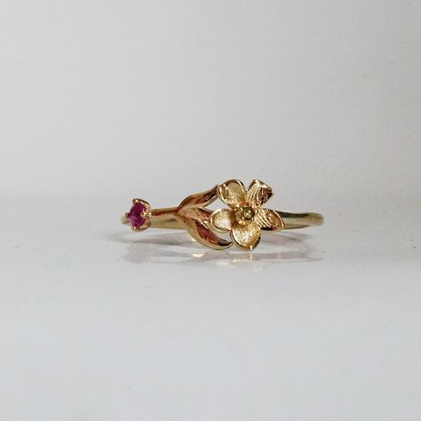 Our special collection of birth flower rings are inspired by the love of wearing something meaningful. Each birth flower is adorned with that month's birthstone. July's birth flower is Water Lily and the birthstone is ruby. Materials: - 14K solid gold - 2mm natural ruby - 1.1mm band thickness ** This item is specially made for you. Please allow 1-2 week lead time.  Shipping: Domestic: Free standard shipping via USPS  International: $17 for international standard shipping. $10 to Canada Online Re Flower Shaped Birthstone Ring For Anniversary, Fine Jewelry Flower-shaped Birthstone Promise Ring, Dainty Flower-shaped Birthstone Rings, Yellow Gold Birthstone Flower Ring, Fine Jewelry Flower-shaped Ruby Ring Gift, Ruby Flower Ring Gift, Fine Jewelry, Flower Shaped Ruby Ring Fine Jewelry Gift, Fine Jewelry Ruby Ring With Flower Shape, Anniversary Yellow Gold Flower Ring With May Birthstone