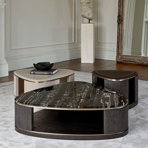 Elevate your living space with our Jenny coffee table trio, a statement arrangement designed for larger rooms. This cluster of three tables varies subtly in shape and height, offering both visual interest and versatile functionality. Choose from a variety of finishes to match your décor, with the option to top one or more tables with luxurious marble. This dynamic grouping invites creativity in layout and styling, making it the perfect centrepiece for spacious interiors. Whether used together fo Coffee Table Set Of Three, Baxter Coffee Table, Luxury Center Table, Marble Centre Table, Statement Arrangement, Centre Tables, Centre Table Living Room, Interrior Design, Top Sofas