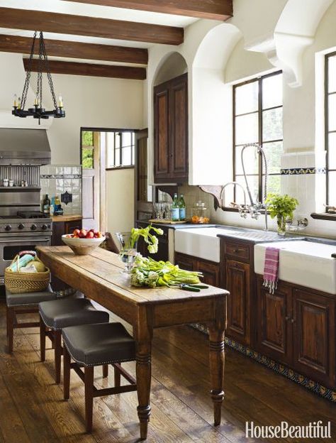 A one-of-a-kind antique piece will add something special to any space. Take, for example, this Spanish Colonial Revival kitchen's 1850s English refectory table, which has a character-filled surface that echoes the wood beams above. Click through for more of the best kitchen tables. Dapur Rustic, Global Boho, Spanish Kitchen, Island Table, Narrow Kitchen, Farmhouse Kitchen Island, Tuscan Kitchen, Spanish Style Homes, Spanish Revival