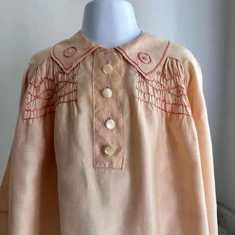 1920s hand made pongee silk blouse dress with Liberty vibes. Soft peachy cream with coral smocking and embroidery, pearl buttons. A… | Instagram Smock Blouse, Pearl Buttons, Blouse Dress, Silk Blouse, Smocking, Hand Made, Coral, Vintage Fashion, Embroidery