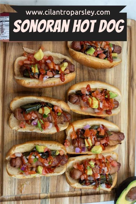 This Sonoran Hot Dog Recipe is made by wrapping each hot dog with bacon, baking them, and topping each hot dog with jalapeños and pico. Sonoran Hot Dog Recipe, Sonoran Dogs, Hod Dog, Mexican Hot Dogs, Sonoran Hot Dog, Hot Dog Recipe, Bacon Wrapped Hotdogs, Cilantro Parsley, Wrapped Hot Dogs