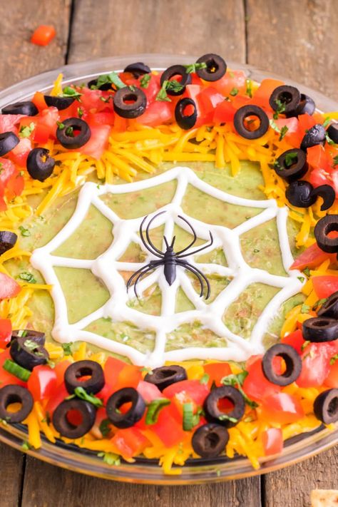 Spider Web Taco Dip - Amanda's Cookin' - Apps & Finger Foods Spiderweb Taco Dip, Spider Web Taco Dip, Halloween Taco Dip, Pineapple Dream Dessert, Halloween Party Appetizers, Mexican Chicken Casserole, Halloween Food Appetizers, Blueberry Breakfast Cake, Chocolate Lasagna