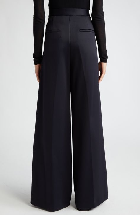 An ultrawide-leg silhouette defines these polished pants tailored from cotton-enriched jersey with beautiful drape. 34" inseam; 31" leg opening; 13 front rise; 15" back rise (size 8) Zip fly with hook-and-bar closure Front slant pockets; back welt pockets 60% polyamide, 40% cotton Dry clean Imported Designer Clothing Drape Pants, Wrap Coat, Beautiful Drapes, Flare Trousers, Tailored Pants, Max Mara, High Waisted Trousers, Black Pants, Wide Leg Pants