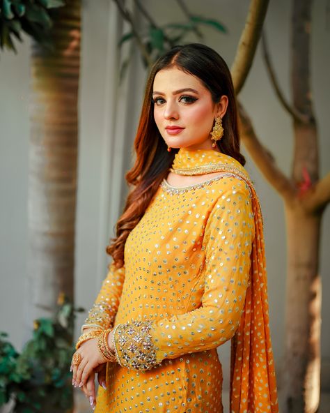 GULAAL is a classic majestic look, well suited for formal occasions. This beautiful Mustard yellow sharara is adorned with reverie like embellishments, rendered in a glowing pearl, gotta and zardozi work. Paired with gorgeously accented flowy raw silk sharara with motif spray and adorned borders. The elegant look is completed with an chunri chiffon dupatta, adding details of kiran lace, to make it an ideal festive wear. #gulaal #chunri #traditional #ridableh #SN #snatelie #launchingsoon Raw Silk Sharara, Yellow Sharara, Silk Sharara, Zardozi Work, Adding Details, Chiffon Dupatta, Festive Wear, Raw Silk, Festival Wear