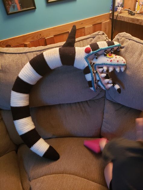 This is a one of a kind handmade sandworm from beetlejuice.  I crocheted this with yarn and it took me 14 days to complete it.  This sandworm is 4ft long. It is so amazing for around the house decor or even as part of a halloween costume.  This is a finished plushy/stuffy not a pattern.  Thank you for stopping by :) If looking for the pattern it can be found here https://www.etsy.com/listing/1057179561/halloween-sandworm?ga_order=most_relevant&ga_search_type=all&ga_view_type=gallery&ga_search_query=sandworm&ref=sr_gallery-1-1&bes=1&sts=1&dd=1&organic_search_click=1 Sand Worm Beetlejuice Crochet, Crochet Beetlejuice Sandworm, Beetlejuice Sandworm Crochet, Crochet Sandworm, Crochet Beetlejuice, Hanging Potted Plants, Creepy Stuffed Animals, Beetlejuice Sandworm, Shadow Monster