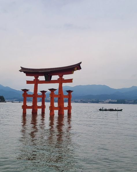 a boat passing by a japanese shrine that's slightly submerged in water Japanese Shrine, Vision Board