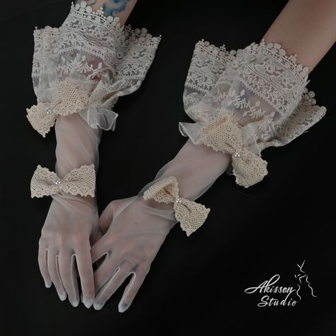 Embrace vintage elegance with our Victorian-Style Retro White Bridal Gloves. Crafted from smooth, high-quality fabric, these gloves feature beautiful ribbons that capture the timeless charm of the Victorian era. Perfect for brides seeking a touch of retro sophistication, these gloves add a graceful and romantic finishing touch to your bridal look. Length(fingertip to end): 47cm/18.5 inch Shipping takes 12-15 business days after order confirmation. Inventory: As this product is 100% handcrafted a 18th Century Gloves, Victorian Fashion Aesthetic, Soft Victorian Aesthetic, Victorian Gloves, Gloves Elegant, Hip Jewelry, Victorian Accessories, Blue Strawberry, Formal Gloves