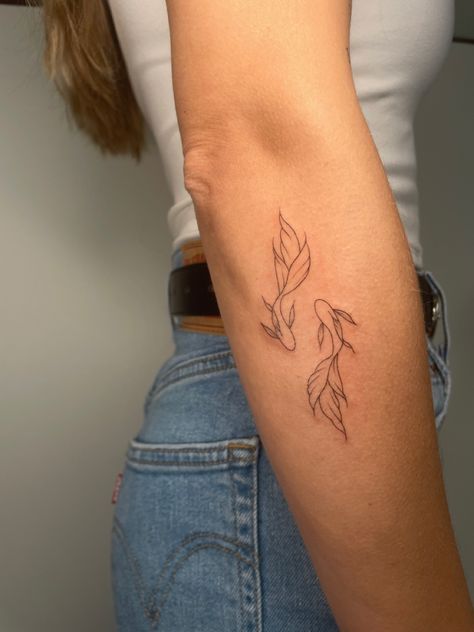 Dainty Coy Fish Tattoo, 3 Small Tattoos In A Row, Word Coverup Tattoo Ideas, Colour Fine Line Tattoo, Back Of Arm Small Tattoo, Koi Fish Minimalist Tattoo, Koi Fish Elbow Tattoo, Koi Fish Leg Tattoo Women, Joy Fish Tattoo