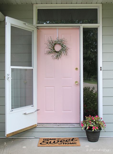 This pretty in pink front door is ga ga gorgeous!! Bella pink front porch, wowzas! Adore the home sweet home rug too! Such a cute porch decor idea! Pink Door Gray House, Pink Front Door Sherwin Williams, Pink Front Porch Decor, Pink Front Door Tan House, Pink Front Door Colors, Light Pink Front Door, Light Pink Door, Paint Doors, Cottage Colors