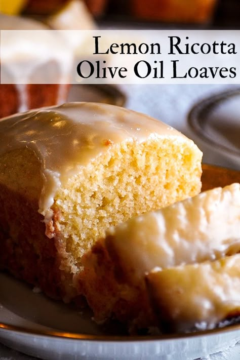 These delicious little Lemon Ricotta Olive Oil Loaves are impossibly moist and tender, with a bright lemon flavor and sweet-tart lemon glaze. #lemonbread #lemonloaves #lemoncake #oliveoil #cake #loaf | ofbatteranddough.com Baking With Yogurt, Olive Oil Cakes, Olive Oil Cake Recipe, Lemon Olive Oil Cake, New Year's Desserts, Lemon Bread, Oil Cake, Slow Cooker Desserts, Loaf Cakes