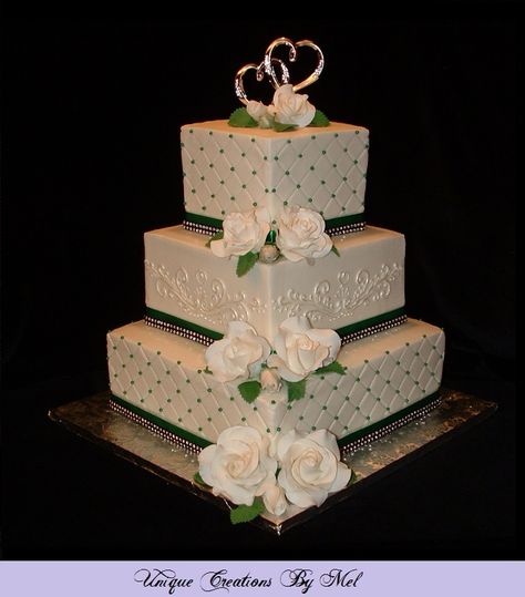 3-Tier square wedding cake with buttercream icing, white roses, emerald green pearls, diamond impression, rhinestone & emerald green ribbons. Emerald Green Cake Ideas, Wedding Cake Green Gold, 3 Tier Square Wedding Cake, Pink Gold Wedding Cake, Wedding Cake Emerald Green, Rhinestone Wedding Cake, Buttercream Wedding Cakes, Wedding Cake Simple Elegant, Wedding December