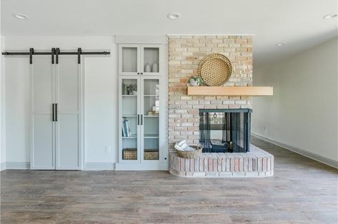 This brickwork draws just the right amount of attention to this wrap-around fireplace. Wrap Around Fireplace, Home Design Drawing, Joanna Gaines Design, Joanna Gaines House, Indoor Outdoor Fireplaces, Hotel Facade, Industrial Design Style, Double Sided Fireplace, Waco Texas