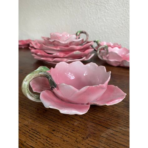 Set of Italian hand painted, handmade rose bud dessert/tea set. The teacups have curled petals with rosebud stem handles. Variations of color from deep rose to the softest pale pink showcase the hand painting. They are so lifelike and delicate! Incredible detail.   There is some chipping to some of the petals on the cups and two plates have hairline cracks. See photos.   There are 9 plates and 10 cups.   These would make an adorable spring table. Also imagine as precious for a child’s birthday d Cute Tableware Set, Vintage Pink Plates, Flower Tea Set, Pink Stuff To Buy, Ceramic Sketchbook, Teacup Bouquet, Aesthetic Plates, Spring Ceramics, Ceramics Aesthetic