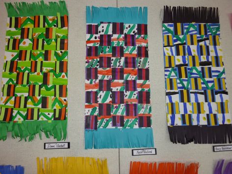 Students in 2nd grade studied fabric designs from all around the world. They learned about the different uses for fabrics and the patterns and designs created on fabrics. They looked at Navajo Weavings, Hmong Clothing, Mexican Blankets, Malawi Chitenjes and focused on Kente Cloths from Ghana. Kente cloth is a fabric made of woven cloth strips. Kente cloth is a royal and sacred cloth that was traditionally worn only by important people and was the called the cloth of kings. Over time the use of k Kente Cloth Art Project, Kente Cloth Art Lesson Project For Kids, Kente Cloth Designs, Kente Cloth Patterns, Ghana Kente Cloth, Hmong Clothing, Hmong Clothes, Navajo Weaving, Cultural Crafts