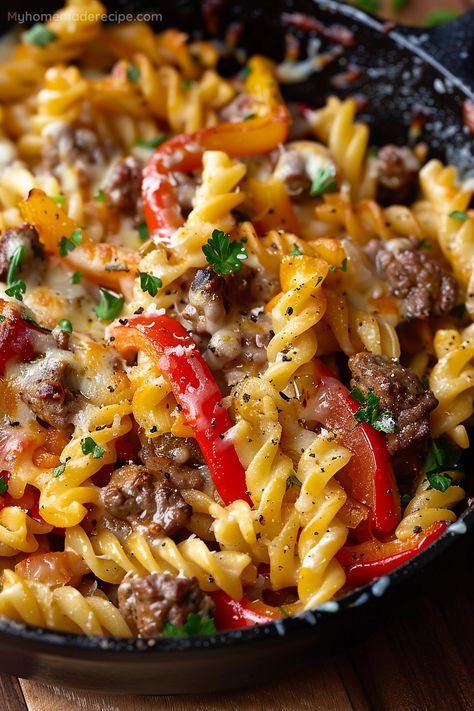 This Philly Cheesesteak Pasta Skillet combines the heartiness of Philly's favorite sandwich with the comforting embrace of pasta, all melded together in a dish that's sure to become a new family favorite. Easy Dinner Ideas Using Ground Beef, Dinner Skillet Ideas, Beef Recipes Pasta, On The Go Dinners Families, Chipped Beef Recipes Dinners, Skillets For Dinner, Recipes Using Philly Steak Meat, Healthy Dinner Ideas With Ground Beef, Beef With Pasta Recipes