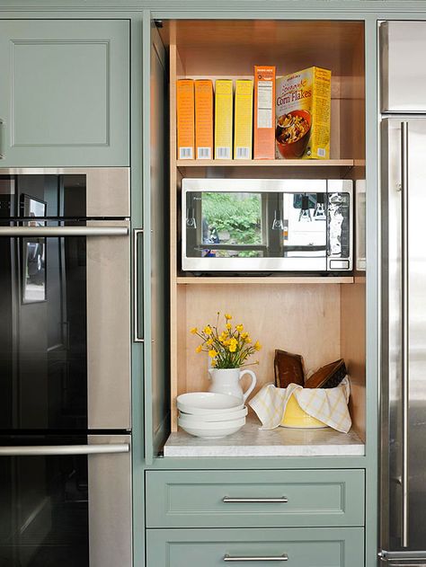 Slide-back doors keep microwave accessible while also having the option to conceal it for a clean look. Hidden Microwave, Microwave Cabinet, Appliance Garage, Hidden Kitchen, Appliances Storage, Pantry Cabinet, Trendy Kitchen, Kitchen Remodel Idea, Kitchen Pantry