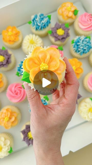 Cara Pile on Instagram: "Buttercream flowers using @wiltoncakes piping tips 🧁 all linked in my Amazon video 🔗in bio  . 🤍 tip 103 💜 tip 366 (all the 🍃too) 🩷 tip 1M 🩵 tip 1M 🧡 tip 104  . . . #cupcakereel #cupcakepiping #cupcakepipingvideo #wilton1m #wiltoncakes #buttercreamflowers #floralcupcakes #flowercupcakes #springcupcakes #cupcakedecorating #cupcakedecoratingvideo #buttercreamcupcakes #wichitaks #andoverks  . . . I don’t own any rights to this song and chose it from the selection on insta 🎶" 1m Decorating Tip, Wilton 1m, Cupcake Piping, Spring Cupcakes, Piping Flowers, Wichita Ks, Amazon Video, Icing Design, Buttercream Cake Decorating