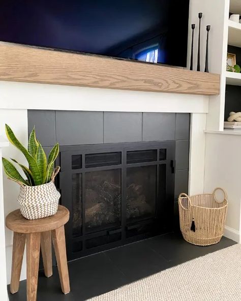 As part of this fireplace makeover, learn how to make a mantel and paint tiles to update the look of your fireplace. Townhouse Fireplace Makeover, No Tile Fireplace, Diy Fireplace Makeover Rental, Fireplace Surrounds And Mantels Tile, Tile Around Fireplace Ideas Mid Century, Diy Rental Friendly Fireplace, Diy Fireplace Refacing, Basic Tile Fireplace, Tile Pellet Stove Surround