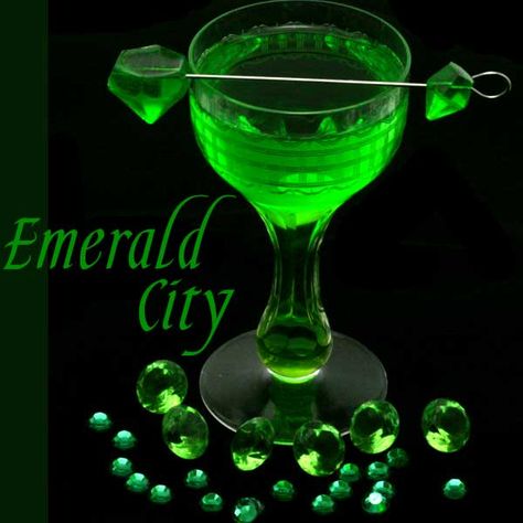 This emerald inspired melon cocktail is a take on the classic margarita with melon liqueur, fresh lime juice, and served with an emerald gemstone gummy. The Emerald City is part of a series of cocktails inspired by gemstones. The emerald is unique among other precious stones in that it is always “flawed”. Emeralds have many … … Continue reading → Wizard Of Oz Cocktails, Melon Margarita Recipe, Melon Margarita, Melon Cocktail, Green Cocktails, Emerald Green Cocktail Dress, Emerald Cocktail, Green Melon, Gummies Recipe