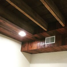 Hide duct work and ceiling wires in basement with something a bit more inspiring and inviting.  Refaced reclaimed wood stained with Red Chestnut 232 (mineax) Basement Remodeling Diy, Basement Ceiling Options, Low Ceiling Basement, Basement Guest Rooms, Basement Inspiration, Diy Basement, Basement Bedroom, Waterproofing Basement, Small Basements