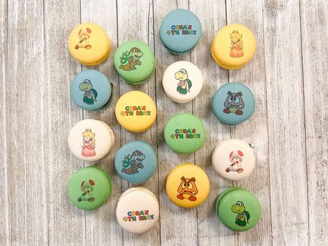 italian macarons | MACamisu ™ on Instagram: “Who loves Super Mario Bros? ❤️💚 📍8876 Vintage Park Dr., Ste 101 Sacramento, CA 95828 ⏰ M-F 8AM-6PM ⏰ SAT & SUN 10AM-5PM…” Mario Kart Food, Super Mario Macarons, Mario Food Labels, Super Mario Star Cookies, Italian Macarons, Boba Bar, Macaron Tower, Banana Pudding, Super Mario Bros