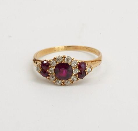 This is a 2.2 Gram 15K Yellow Gold Vintage Mid-Victorian Era Superb Delicate Ruby and Diamond Ring, Circa 1870. Size 6.75.  It is pre owned but shows little if any wear.  Stock # BB32R34 This listing contains photographs of the actual item you will receive.  Our items are in excellent condition with little or no signs of wear and many are one of a kind pre-owned estate finds.   Please look closely at the pictures in this listing as they are part of the product description. Please read the description, as any imperfections or condition comments will be included.  We do our best to accurately describe the condition of each piece and encourage you to ask questions prior to purchase.  Due to a large number of unqualified returns, we will be charging a 20% restocking fee. If for some reason, th Stoneless Wedding Ring, Victorian Era Rings, Regency Engagement Ring, Victorian Ruby Cluster Ring For Wedding, Victorian Ruby Ring With Center Stone, Victorian Red Cluster Ring For Wedding, Victorian Hallmarked Cluster Ring, Ruby Wedding Ring Vintage, Vintage Gold Engagement Rings Unique