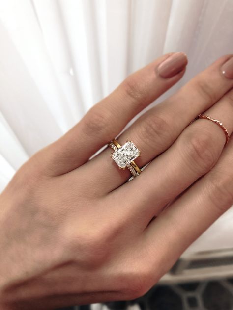 Feeling radiant 😍⁠ Notice the ultra fine split prongs on this beau? Well you should see the exposed sides... 😱⁠ Designed to sit perfectly flush to our wedding bands, the result is absolute elegance and the most refined of pairings 💕 Rectangle Wedding Ring And Band, Wedding Band With Gold Engagement Ring, Unique Prong Setting, Radiant Wedding Ring With Band, Gold Rectangle Engagement Ring With Band, Moissanite Engagement Ring With Wedding Band, Wedding Band Flush With Engagement Ring, Wedding Rings Gold Square, Classy Wedding Ring Set