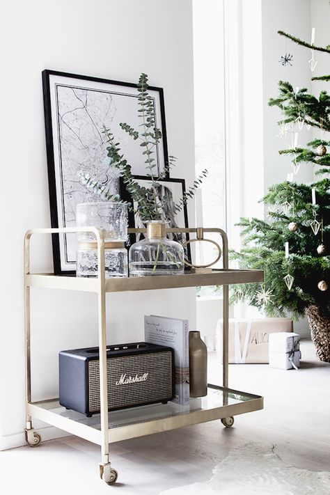 Getting into the 'spirit' of Christmas with a brass drinks trolley (from Nordal).  / Photograhy Niki / Brantmark - My Scandinavian Home  Blog (styling - Genevieve Jorn). Sweet Home Design, Bar In Casa, Interior Design Per La Casa, Smart Tiles, Bar Cart Styling, Deco Stickers, Bar Cart Decor, Living Room Scandinavian, Decoration Inspiration