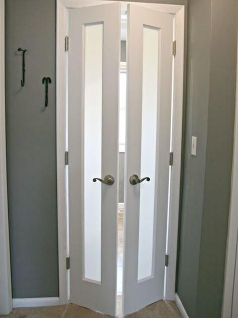 Although doors are pretty much necessary on bathrooms, sometimes it is the door that proves to be a huge obstacle to usable space. As a stylish solution, these split french doors were added to now swing out into the hallway. Frosted glass panels allow light to pass through but maintain privacy. Bi Fold Doors Dining Room, Modern Sliding Bathroom Door, Bathroom Door Alternatives, Door Ideas For Small Spaces, Traditional Small Bathrooms, Doors For Small Spaces, Bathroom Door Ideas, Glass Bathroom Door, Bilik Air