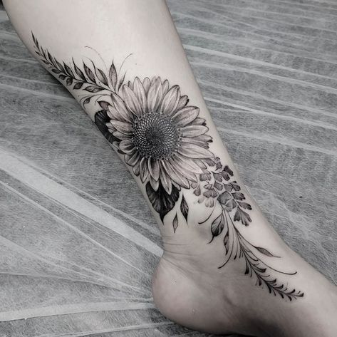 Sunflower Tattoo Ideas Sunflower Tattoo Back Of Leg, Light Tattoo Sleeve, Sunflower Vine Tattoos For Women, Leg Tattoos Sunflowers, Back Tattoo Sunflower, Sunflower Wrap Around Tattoo, Sunflower Thigh Tattoos Women, Side Leg Tattoos Women, Sunflower Leg Tattoo