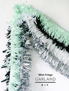 Mini Fringe Garland DIY | Mara Dawn Fringe Garland Diy, Diy Banners, Fringe Garland, Party Photo Frame, Mini Fringe, Diy Prom, Garland Backdrops, Garland Diy, Tinsel Garland