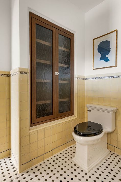 We restored this charming 1930s bathroom to maintain its original yellow and trim. Vintage Bathroom Wall Tile, Old Yellow Tile Bathroom Ideas, 1930s Tile Bathroom, Yellow Ceiling Bathroom, Bathroom Victorian House, 1930s Bathroom Original, Colorful Vintage Bathroom, 1920 Bathroom 1920s Style, 1920s Bathroom Original