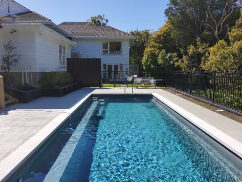 Nz Landscaping, Grey Pool, Coloured Concrete, Pool Oasis, Aluminium Fence, Rectangle Pool, Outdoor Pool Area, Leisure Pools, Fiberglass Swimming Pools