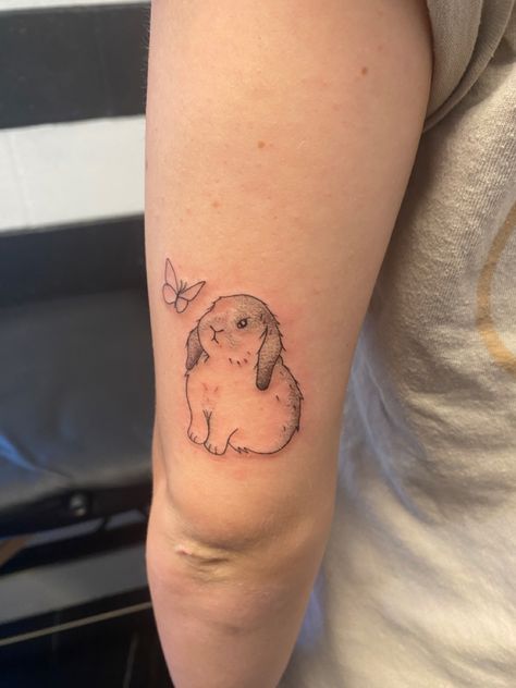 lop eared bunny tattoo with a butterfly Bunny Ear Tattoo, Floppy Eared Bunny Tattoo, Lop Eared Bunny Tattoo, Bunny With Halo Tattoo, Bunny Butterfly, Lop Bunny Tattoo, Bunny With Wings Tattoo, Holland Lop Tattoo, Mini Lop Bunny Tattoo