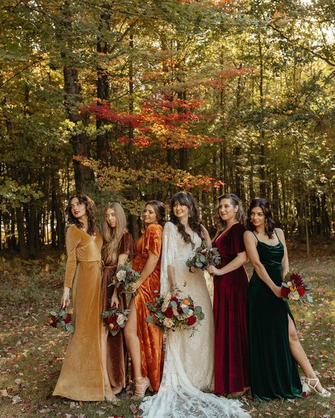 Outdoor bride and bridesmaids portraits with the brides wearing mismatched colored dresses. See more fall wedding color schemes, boho fall wedding ideas, and ideas for your fall wedding bouquets! Book Marissa as your documentary Michigan wedding photographer at marissadillonphotography.com! European Autumn Wedding, Fall Wedding Eclectic, Mix Matched Fall Bridesmaid Dresses, Unique Mismatched Bridesmaid Dresses, Red Bridal Party Color Schemes, Fall Wedding Ideas Bridesmaids, Fall Rustic Bridesmaid Dresses, Fall Pallet Bridesmaid Dresses, Fall Meadow Wedding