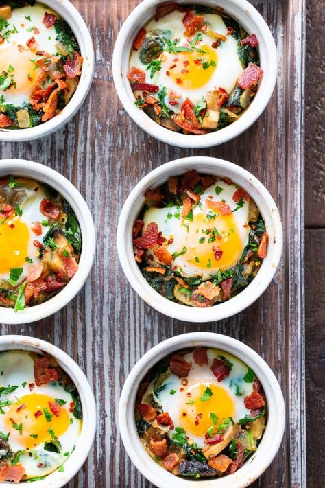 Made in single serving ramekins, these baked eggs are packed with savory goodies and flavor!   Great for weekend brunches and make-ahead friendly for weekdays.  Paleo, Whole30 compliant and keto friendly. Superhero Breakfast, Nutrition Reset, Baked Eggs With Spinach, Ramekin Recipe, Eggs With Spinach, Paleo Breakfasts, Paleo Running Momma, Whole30 Keto, Bacon Stuffed Mushrooms