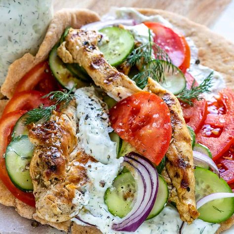 Easy to make Greek Chicken Gryro that's tastier and healthier than takeout. Succulent, marinated chicken breast is grilled to perfection (with those lovely char lines!), then wrapped up with veggies in warm pita and slathered in delicious homemade tzatziki - so good. #gyro #greek #chickengyro #greekchickengyro #chickensandwich Best Chicken Gyro Recipe, Gyro Sandwich, High Protein Chicken, Chicken Gyro, Gyro Recipe, Homemade Tzatziki Sauce, Marinating Chicken Breast, Homemade Tzatziki, Ground Beef Recipes Healthy