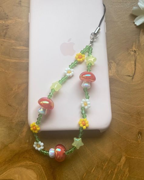 Mushroom phone strap just listed 🍄🍄 #beadedphonestrap #mushroomcharm #phonebeads #mariobros Mushroom Phone Charm, Aesthetic Phone Strap, Phone Straps Beads Ideas, Phone Strap Aesthetic, Diy Phone Charms, Iphone Charms, Phone Charms Aesthetic, Beaded Phone Charms, Accesorios Aesthetic