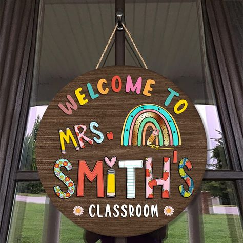 PRICES MAY VARY. LOVE DECORATION: These personalized welcome signs for the classroom front door will be a friendly and hospitable way to show the best welcome to students! Our wooden home sign ensures a charming look and adds an inviting feeling to any door or wall so each student will feel warm and comfortable. This must be a unique and special gift for school teachers. Materials: High-quality plywood, wood thickness measures 1 cm. It is bright and vivid colors, lifelike graphics with high prec Signs For Teachers, Teacher Door Sign, Classroom Door Signs, Teacher Door Signs, Welcome Door Sign, Boho Rainbow Classroom, Classroom Welcome, Teacher Name Signs, Teacher Door